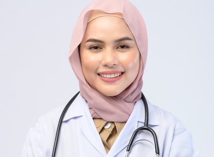 Smiling newly qualified medic female wearing hijab