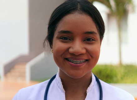 Smiling newly qualified medic female asian