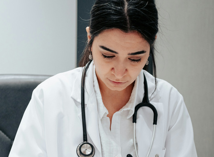 Female medic writing in a book