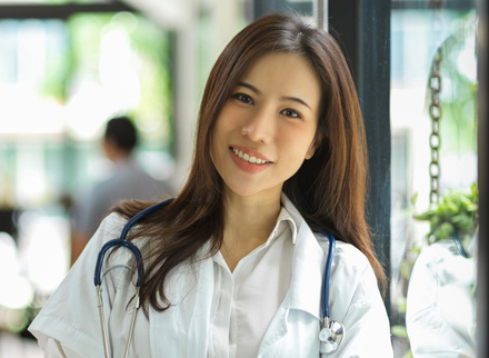 Asian doctor smiling at camera